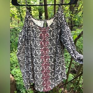 Jolt. Open shoulder lightweight and flowy blouse.large ornamental pattern.